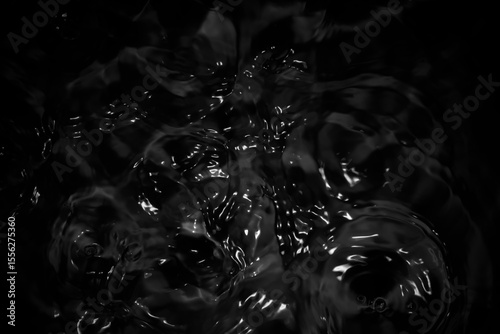 Natural water surface with abstract black softness.