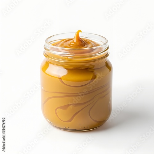 Side view of Doce de Leite in glass jar on white background