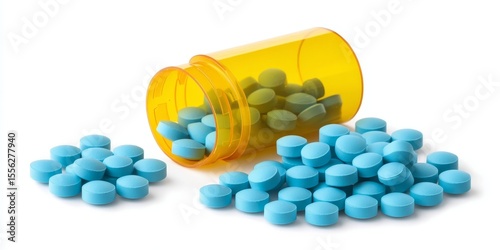 Yellow pill container with scattered blue and yellow tablets on a white surface conveys medical prescription drugs in a clinical setting.
