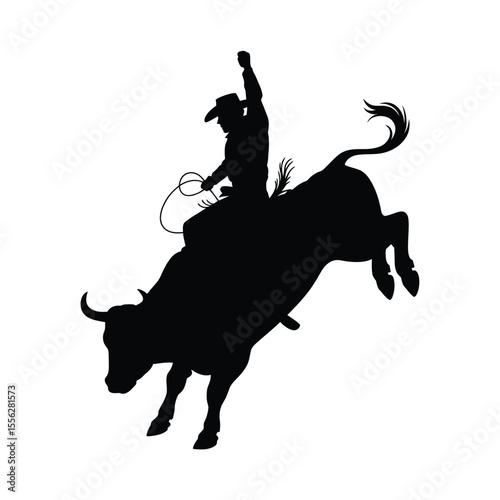 Silhouette of a Cowboy Riding a Bull at a Rodeo