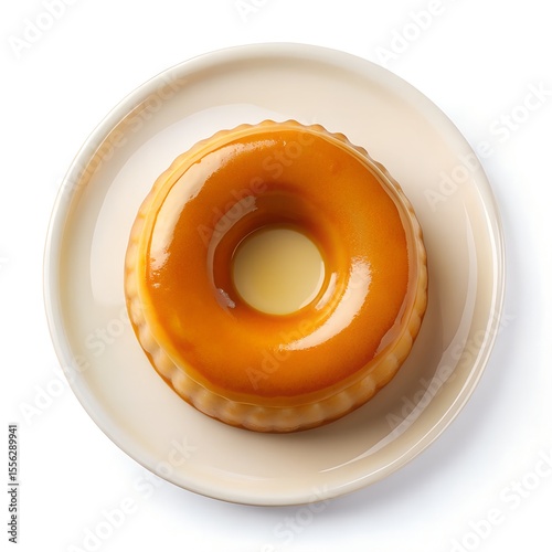 top view of Pudim de Leite Condensado on white plate on white background 

