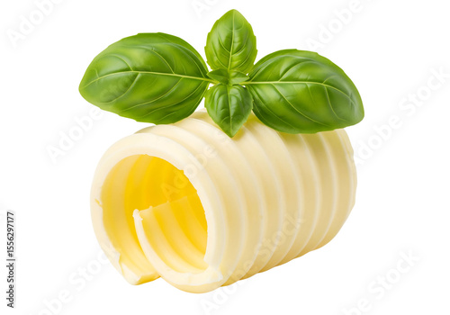 Butter Curls or Rolls with Fresh Basil Leaves Isolated on White Background
