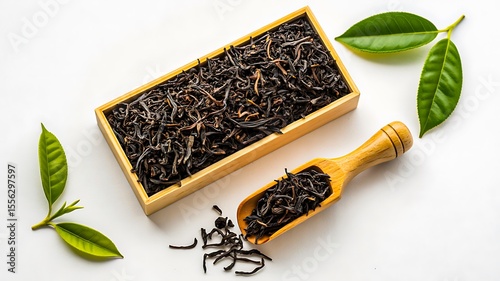 Wallpaper Mural Loose black tea leaves with wooden scoop and green tea leaves on white background
 Torontodigital.ca