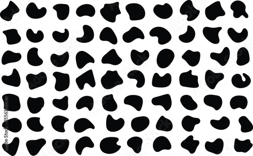 Abstract black organic shapes arranged in a grid creating a contemporary seamless pattern.