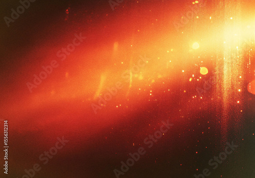 Orange light leak effect on dark textured background with dust and scratches