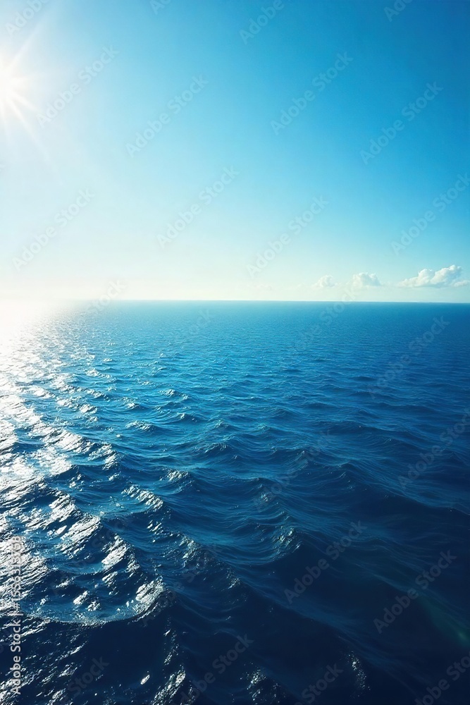 Obraz premium Tranquil Ocean Horizon Sunlight Dancing on Deep Blue Waves, Inspiring Serenity and Limitless Vastness. Perfect for travel, nature, and peaceful themes.
