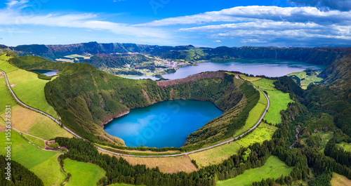Fototapeta Azores island most beautiful scenic places - wonderful emerald lakes Sete Cidades lagoons, high angle aerial view of Boca do inferno volcanic crater