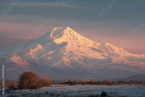 mount elbrus illuminated by evening light under clear sky