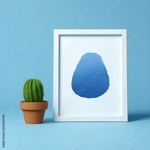 Abstract watercolor splash in white frame on pastel wall, minimalist setup
