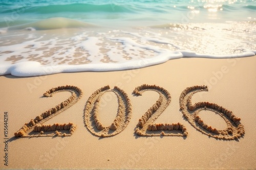 Two digits 2020 written in sand on a sandy beach, possibly used as a temporary marker or message..New Year 2026.