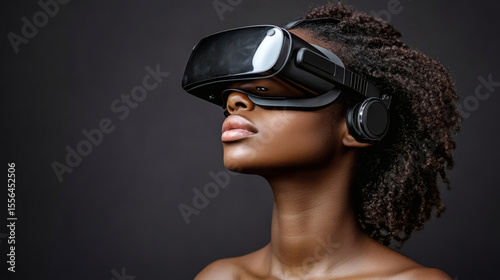 Young Woman Wearing VR Headset, Dark Background