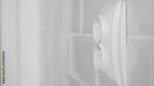 Shooting with a Man Disconnecting a Plug from the Electrical Outlet, Powering Off the Electricity of an Appliance at Home.