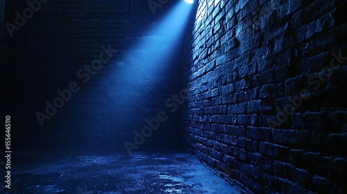 Dramatic Blue Light Shines on Textured Brick Wall in a Mysterious, Moody Indoor Space with Wet Floor.