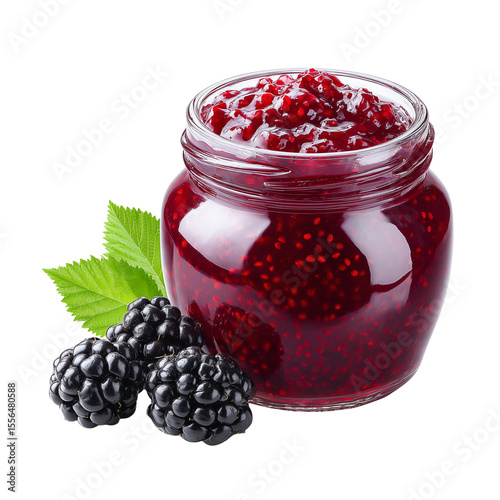 Glass jar of blackberry jam with fresh blackberries