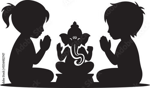 Children praying to Lord Ganesha in silhouette.