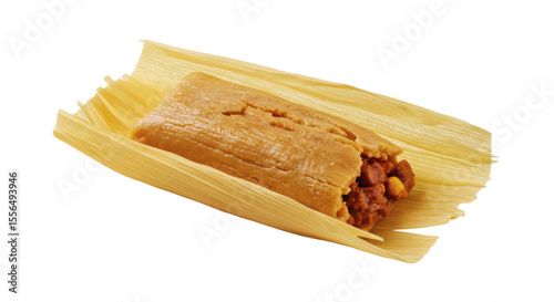 A single tamale in its corn husk wrapper with a meat filling on a plain black background surface