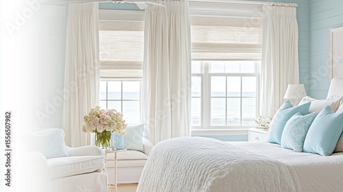 Light and airy bedroom with ocean views.