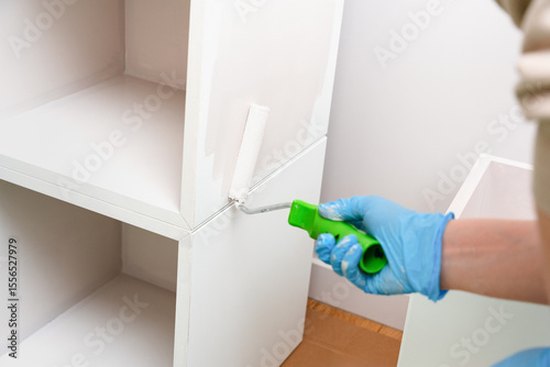 Hand Rolling Paint On Cabinet Edge DIY Project