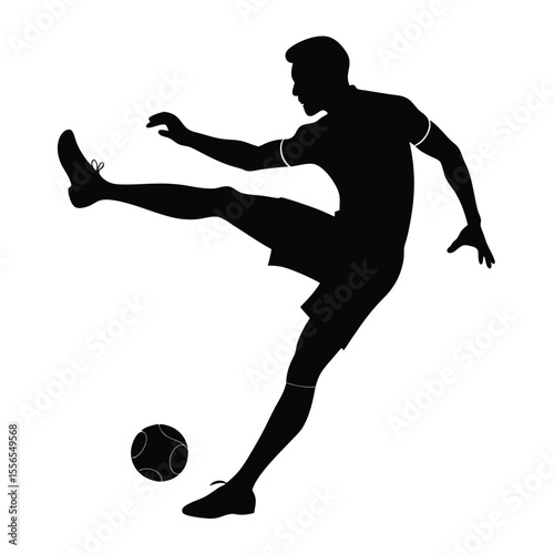 Silhouette of a soccer player kicking a ball during a football match or sports competition action