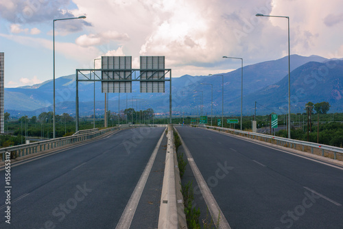 empty highway symmetry road country side view mountain silhouette background scenic landscape