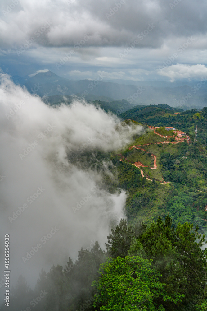 Fototapeta premium Scenic stormy landscape taken form Ambuluwawa Tower, Sri Lanka`s first multi religious center built on top of a solitary mountain near Kandy and Gampola, Sri Lanka, Asia 