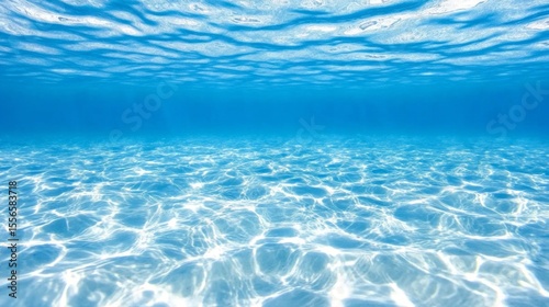 Crystal clear blue sea with stunning underwater view and sun rays, perfect for travel or calendar scene