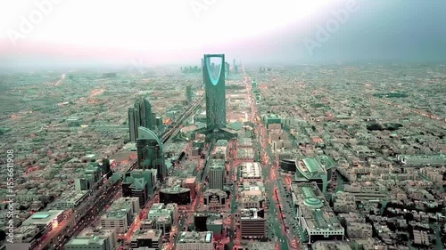 Stunning 4K aerial drone footage of Riyadh city, highlighting the famous Al Faisaliah Tower, modern skyline, urban architecture, and iconic landmarks of the Saudi capital. Captured on January 10, 2024