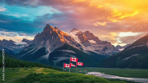 Canadian flags waving in front of majestic mountains at sunset