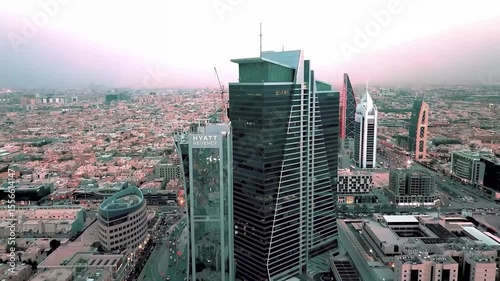 Stunning 4K aerial drone footage of Riyadh city, highlighting the famous Al Faisaliah Tower, modern skyline, urban architecture, and iconic landmarks of the Saudi capital. Captured on January 10, 2024
