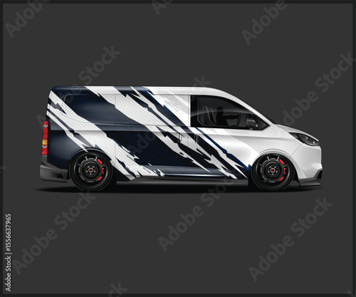 Sleek Van with Custom Wrap and Low Profile Wheels on Dark Background
