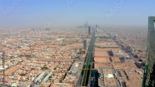 Stunning 4K aerial drone footage of Riyadh city, highlighting the famous Al Faisaliah Tower, modern skyline, urban architecture, and iconic landmarks of the Saudi capital. Captured on January 10, 2024