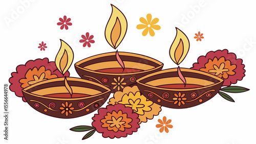 Three traditional Indian clay lamps with lit candles surrounded by flowers.