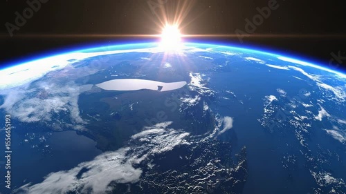The radiant sunrise casts a celestial glow over the Earth, illuminating a vibrant, cloud-strewn atmosphere and suggesting a new day and new possibilities for life.