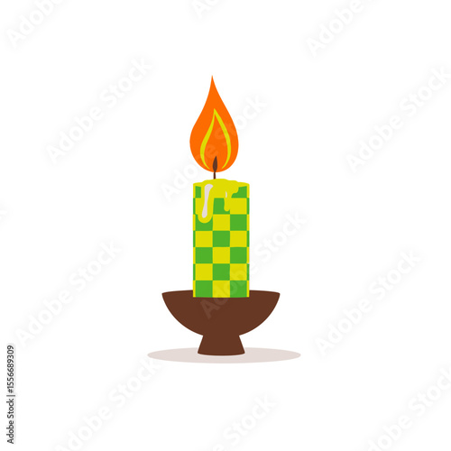 Green and yellow checkered candle burning brightly in a brown holder isolated on white background