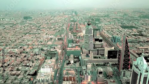 Stunning 4K aerial drone footage of Riyadh city, highlighting the famous Al Faisaliah Tower, modern skyline, urban architecture, and iconic landmarks of the Saudi capital. Captured on January 10, 2024