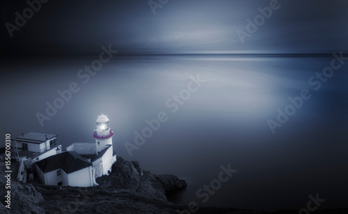 A Serene Lighthouse is Standing Beautifully by the Tranquil Sea during Twilight