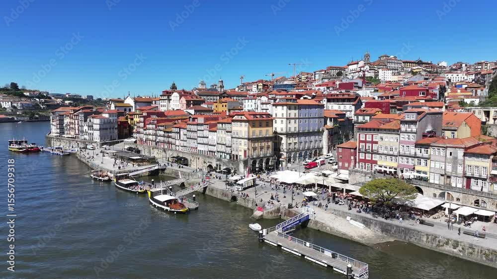 Ribeira Pier In Porto Portugal. Turquoise Ocean Waves Gently Crashing On Tropical Beach. Business Sky Downtown Cityscape. Exterior Downtown Famous. Porto Portugal. Ribeira Pier In Porto Portugal. Turquoise Ocean Waves Gently Crashing On Tropical Beach. Business Sky Downtown Cityscape. Exterior Downtown Famous. Porto Portugal.