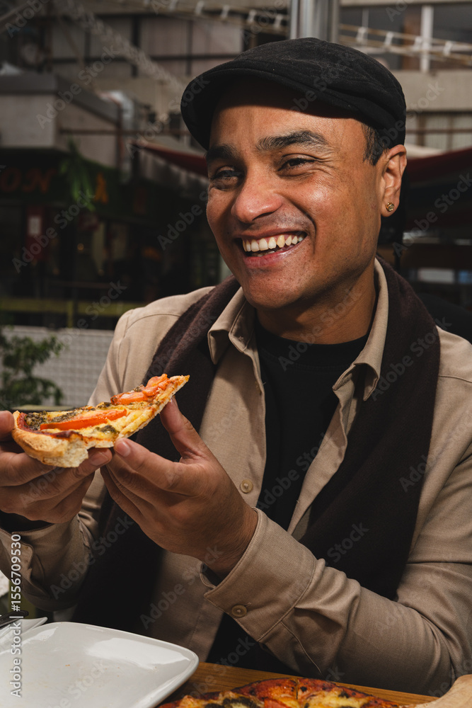 Cheerful man enjoying a slice of pizza at an outdoor cafe. Urban dining experience with laughter and good food Cheerful man enjoying a slice of pizza at an outdoor cafe. Urban dining experience with laughter and good food