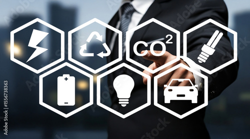 Businessman Touching Creative Icons for Sustainability and Environment in Urban Setting with Symbols of Energy, Emission, and Innovation in Modern City Background