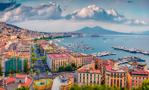 Colorful hoses in the Naples town, Italy, Europe. Beautiful morning seascape of Mediterranean sea. Aerial summer scene of Italian resort city. Vacation concept background.