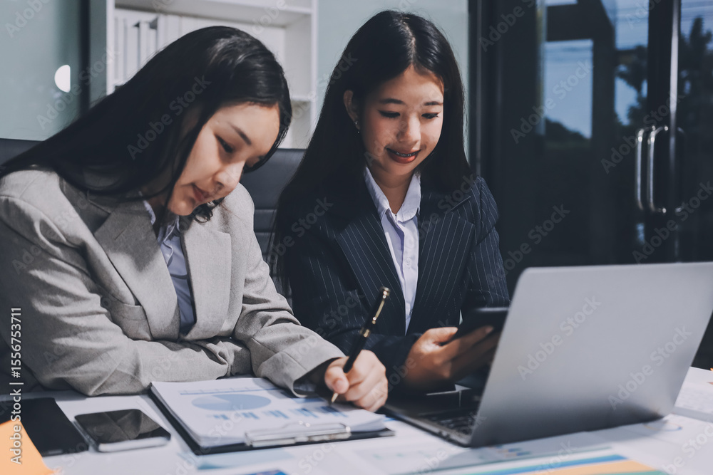 Fototapeta premium Accounting company provide finance and taxation planning for profitable cash flow, Auditor and accountant team working in office, analyze financial data and accounting record with calculator.Insight