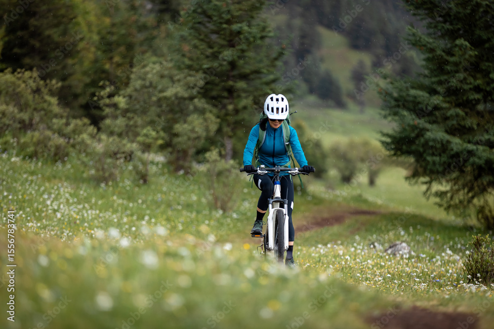 Fototapeta premium Riding mountain bike in the beautiful mountains