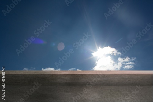 Cloud cluster is glowing under bright sun atop concrete ledge, casting lens flare in flat design