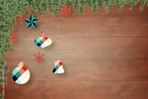 Christmas baubles in front of wood