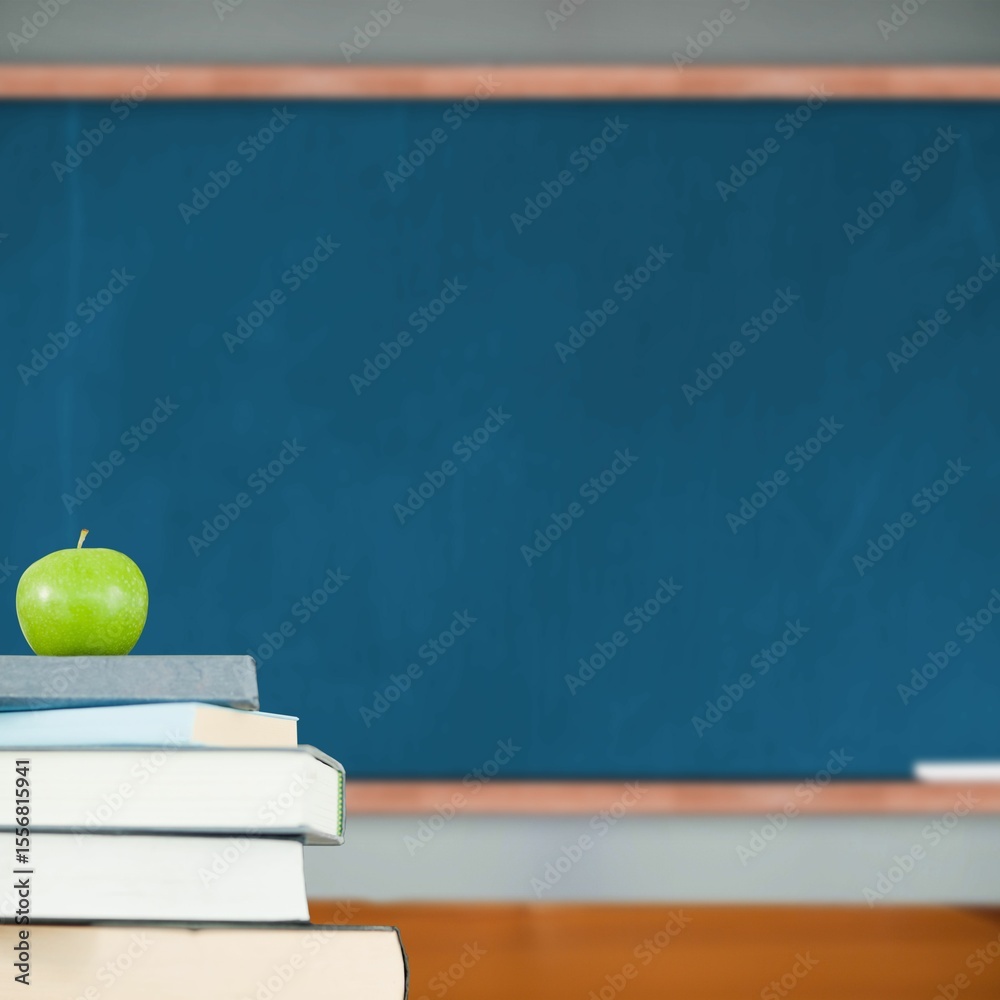 Fototapeta premium Green apple on pile of books in classroom