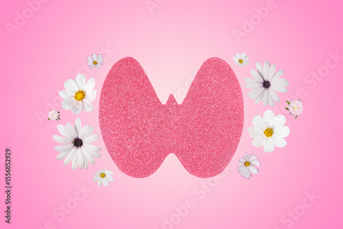 World Thyroid Day. Concept of thyroid disease and health. Pink Paper form of the thyroid gland on pink background with aster, dahlia and cosmea flowers