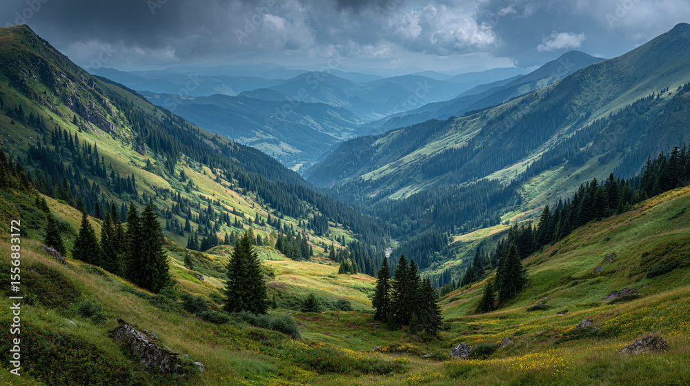 Fototapeta premium A valley with green hills and trees under a cloudy sky in a mountainous region on a summer day