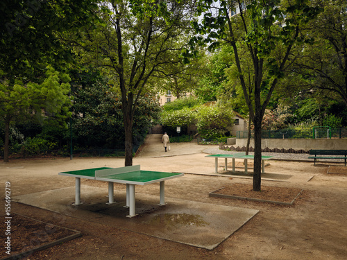 Empty ping pong tables waiting in tranquil city park