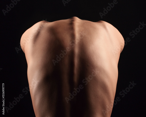 Beautiful female body part on black background.	