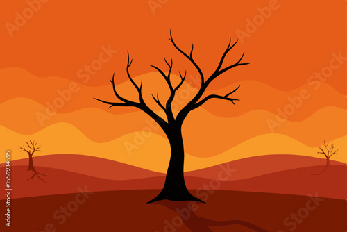Lone dry tree silhouette at sunset in the Namibian desert landscape under an orange sky